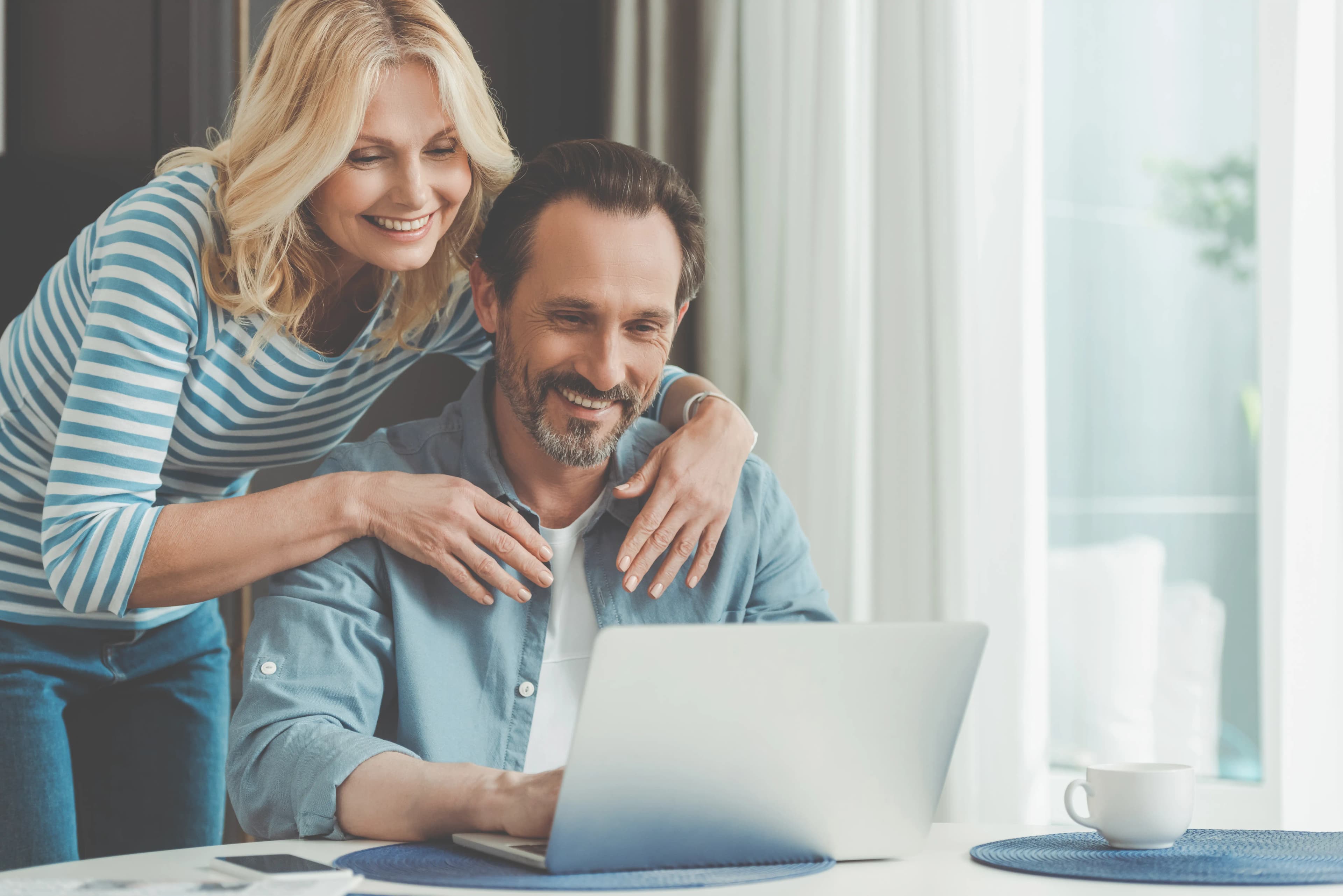 Couple at laptop filling out the property form
