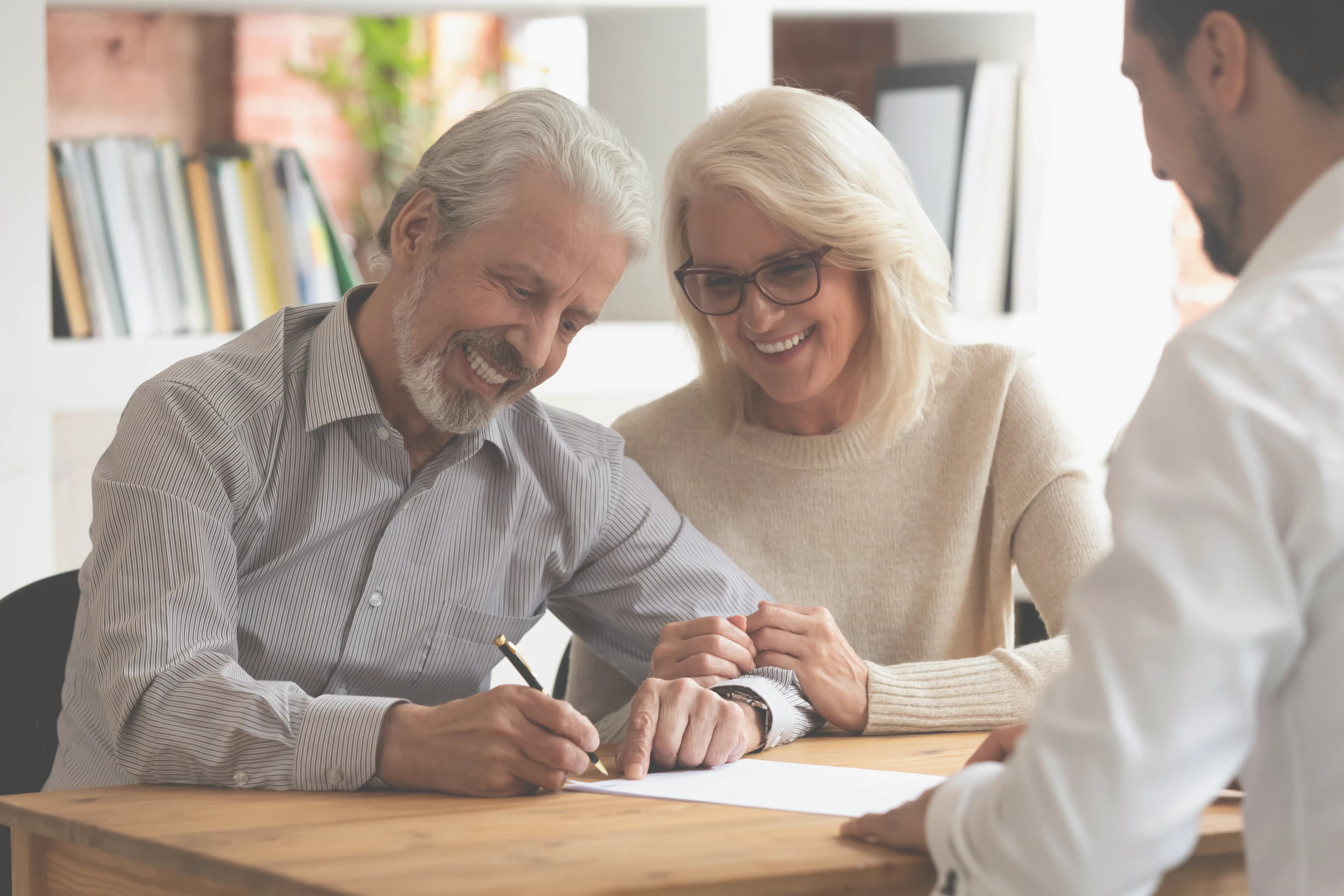 Couple reviewing the cash offer with a Windoor representative